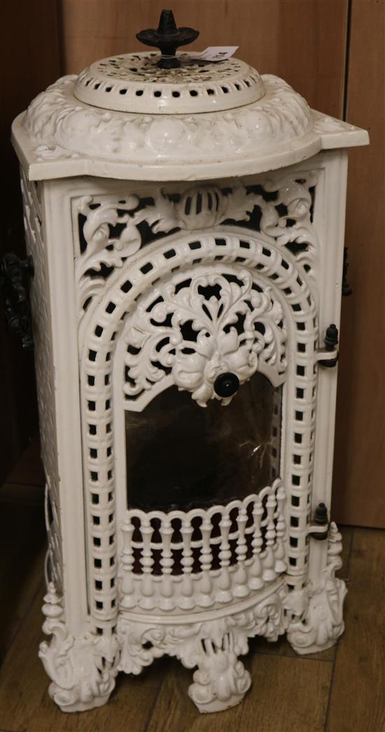 A white painted cast iron stove W.36cm